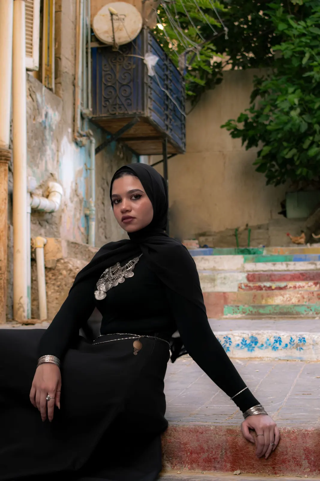 Black hijab on painted steps in Alexandria